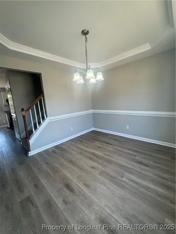 a view of a livingroom with wooden floor