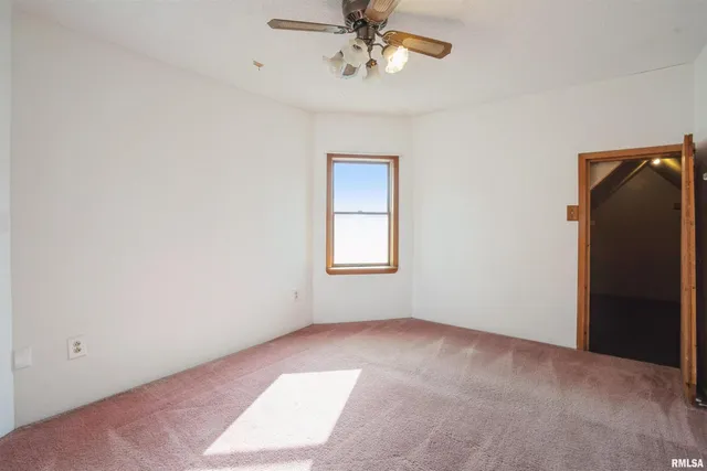 an empty room with a bathroom