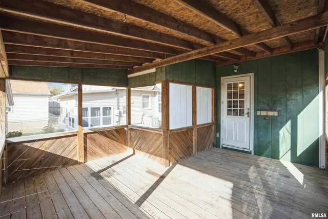 a view of a balcony with wooden floor
