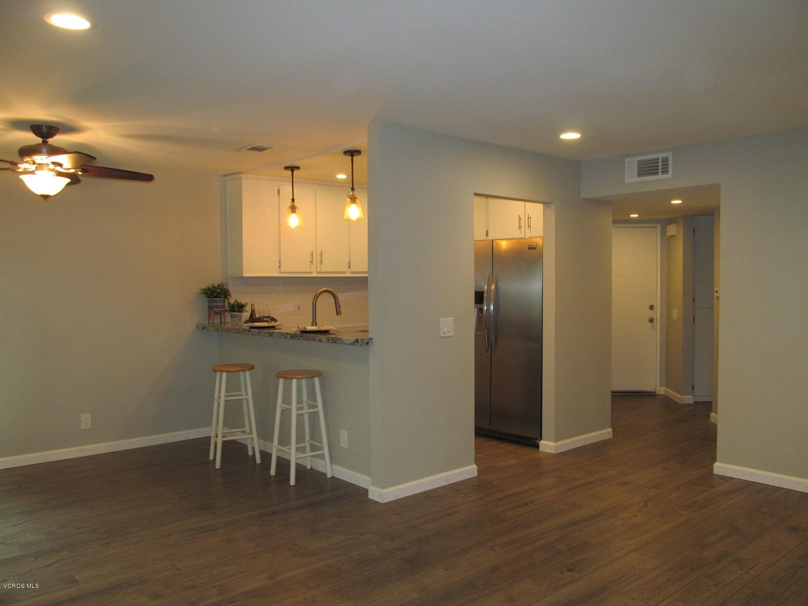 1706 Sinaloa Road, Unit 112 Simi Valley, CA 93065 - Photo 12 of 37 a view of empty room with wooden floor and fan