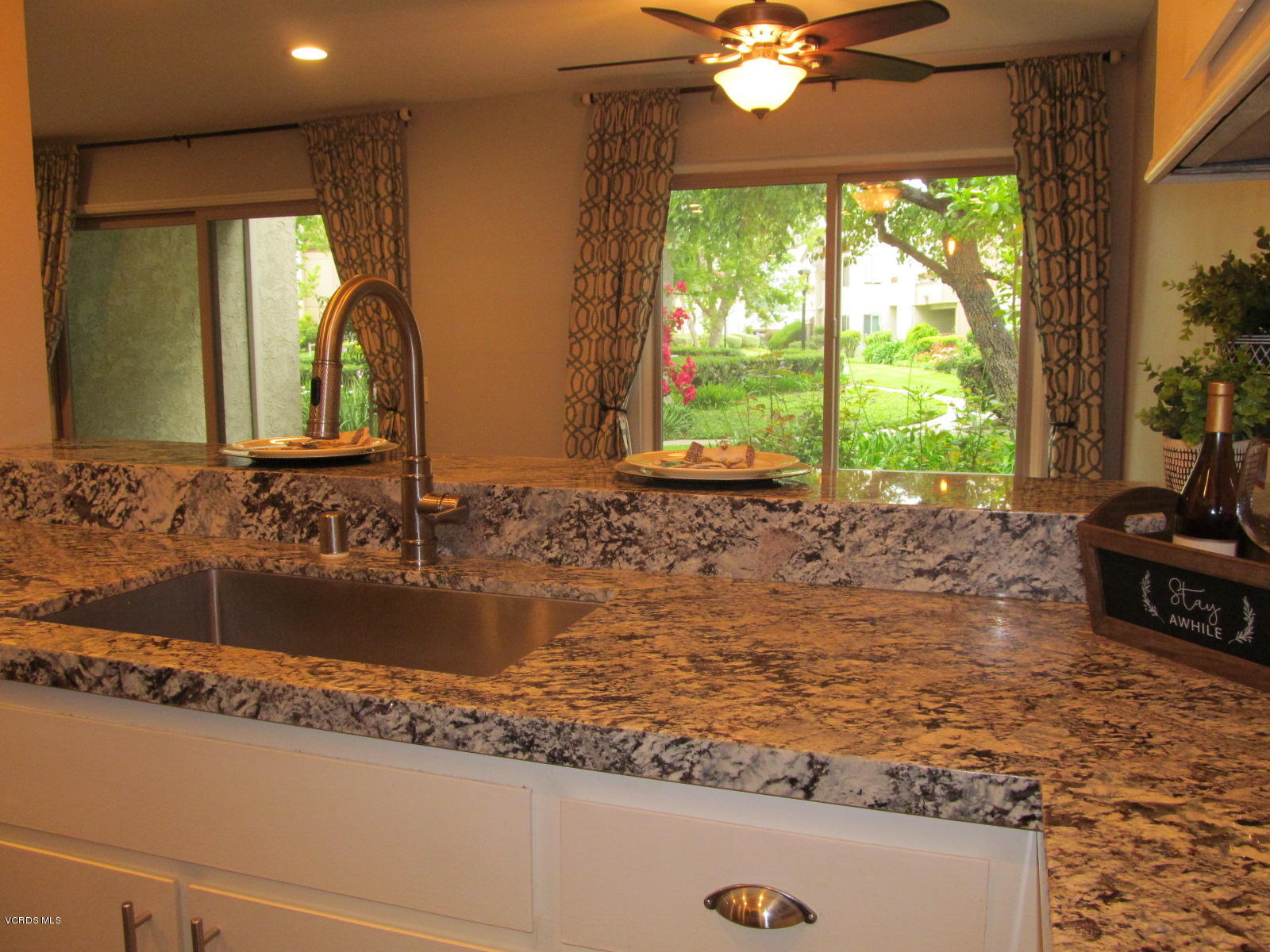 1706 Sinaloa Road, Unit 112 Simi Valley, CA 93065 - Photo 17 of 37 a bathroom with a sink mirror vanity and a bathtub