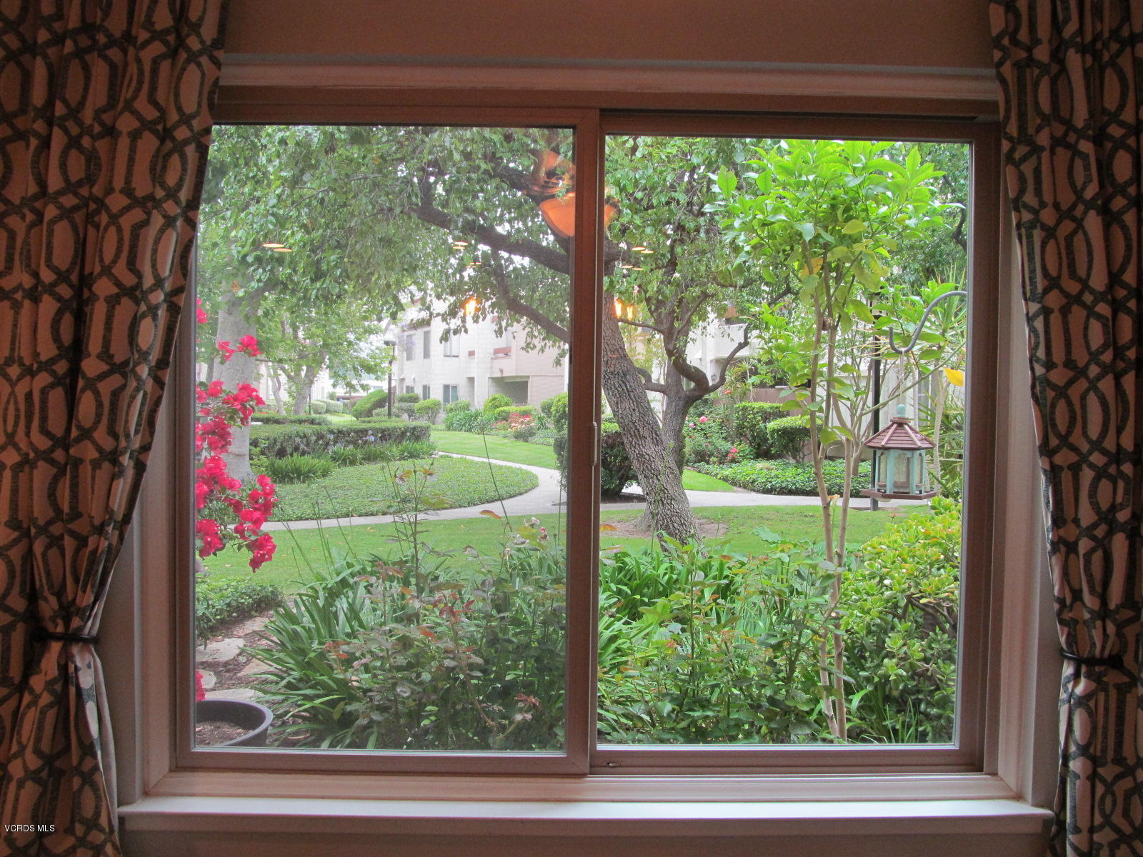 1706 Sinaloa Road, Unit 112 Simi Valley, CA 93065 - Photo 19 of 37 a view of a yard from a window