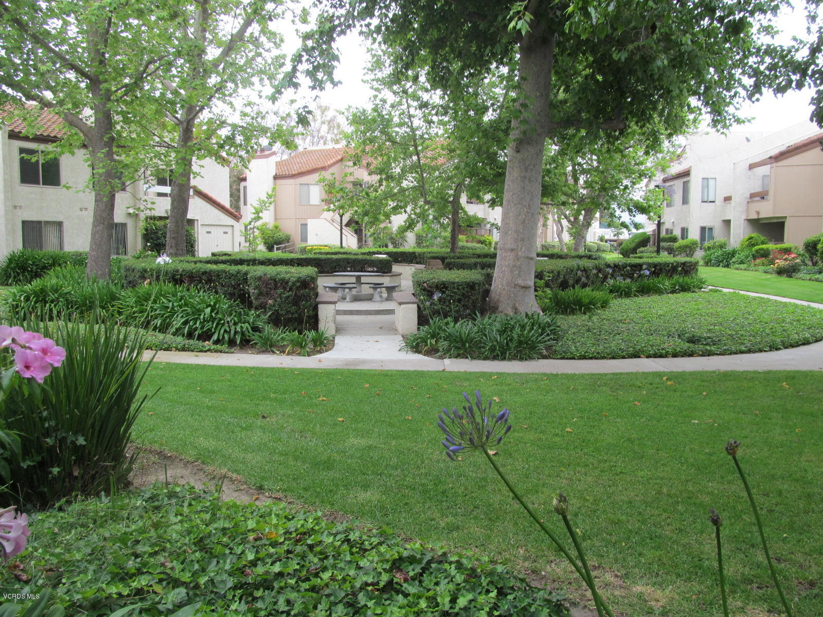1706 Sinaloa Road, Unit 112 Simi Valley, CA 93065 - Photo 29 of 37 a view of a house with a yard and garden