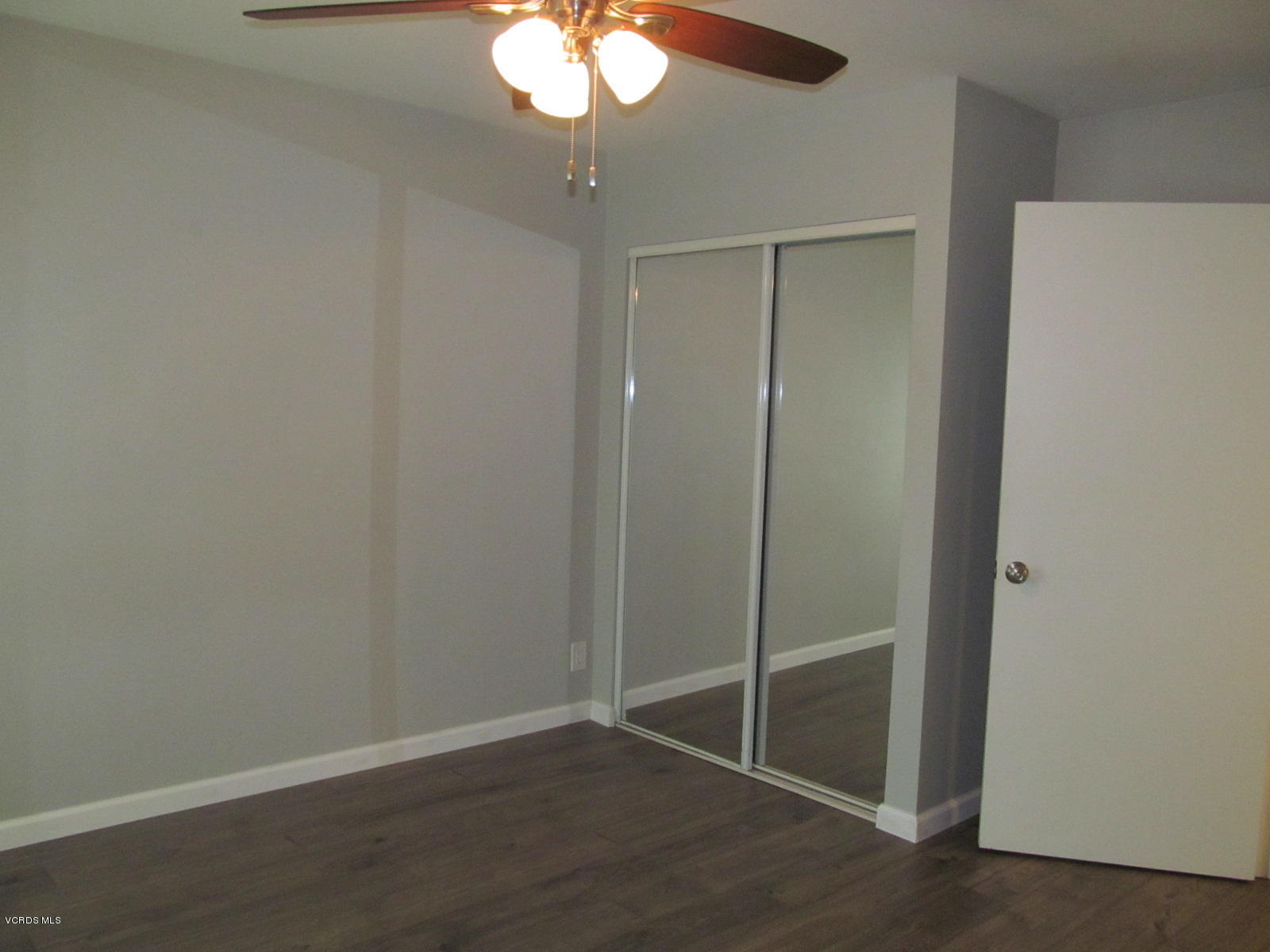 1706 Sinaloa Road, Unit 112 Simi Valley, CA 93065 - Photo 6 of 37 an empty room with wooden floor