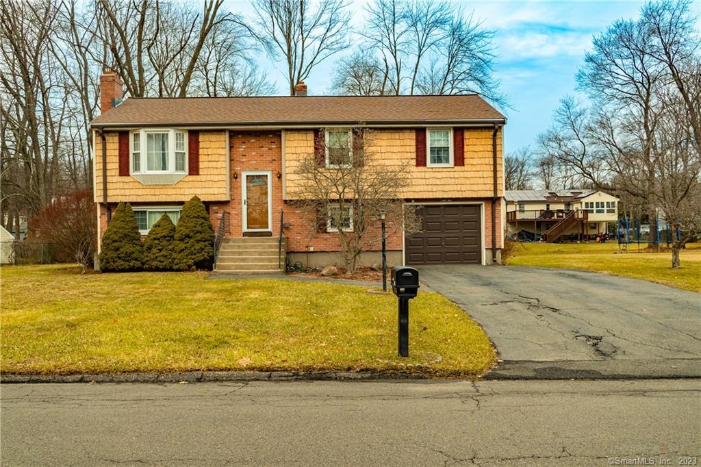55 Lacava Road Bristol, CT 06010 - Photo 1 of 1 a front view of a house with swimming pool