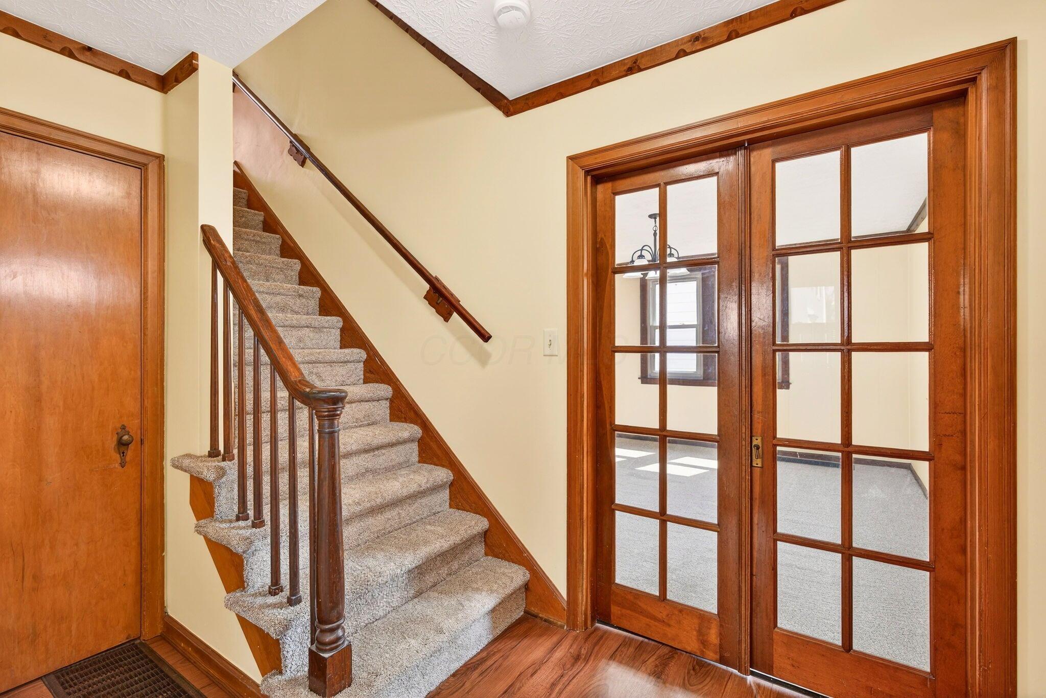 892 North Court Street Circleville, OH 43113 - Photo 13 of 58 Gorgeous original woodwork throughout that is in excellent condition. Beautiful banister and those french doors leading to the dining room are to die for!