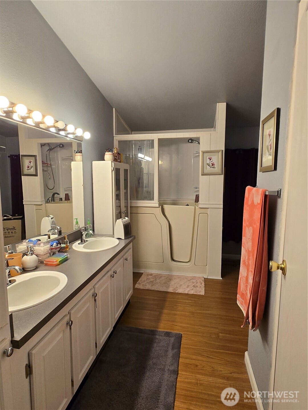 1466 Ferrier Road Winlock, WA 98596 - Photo 24 of 33 a bathroom with a double vanity sink a mirror and a shower