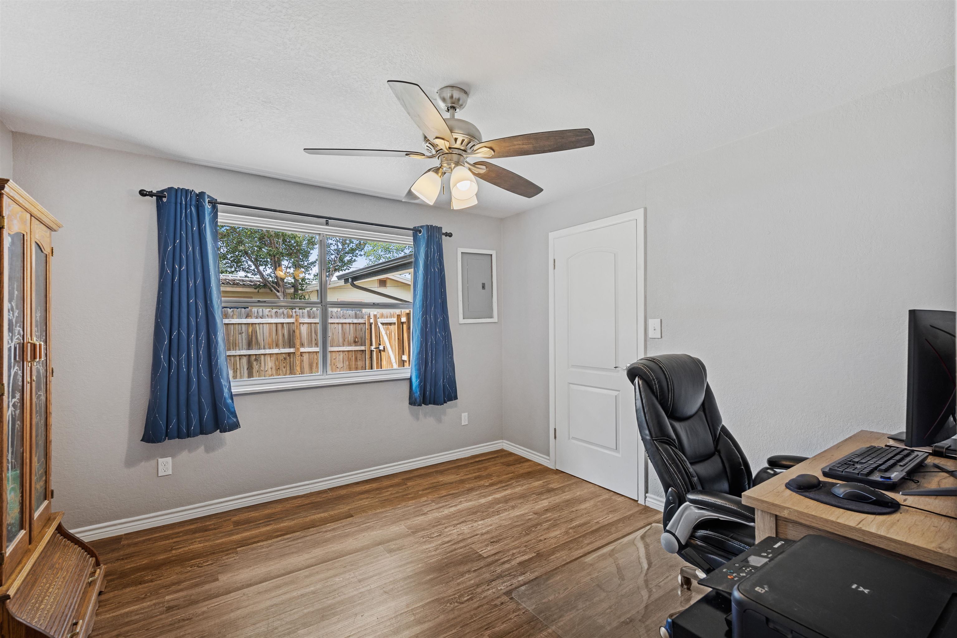 407 Lamon Street Burnet, TX 78611 - Photo 13 of 24 a workspace with furniture and a window