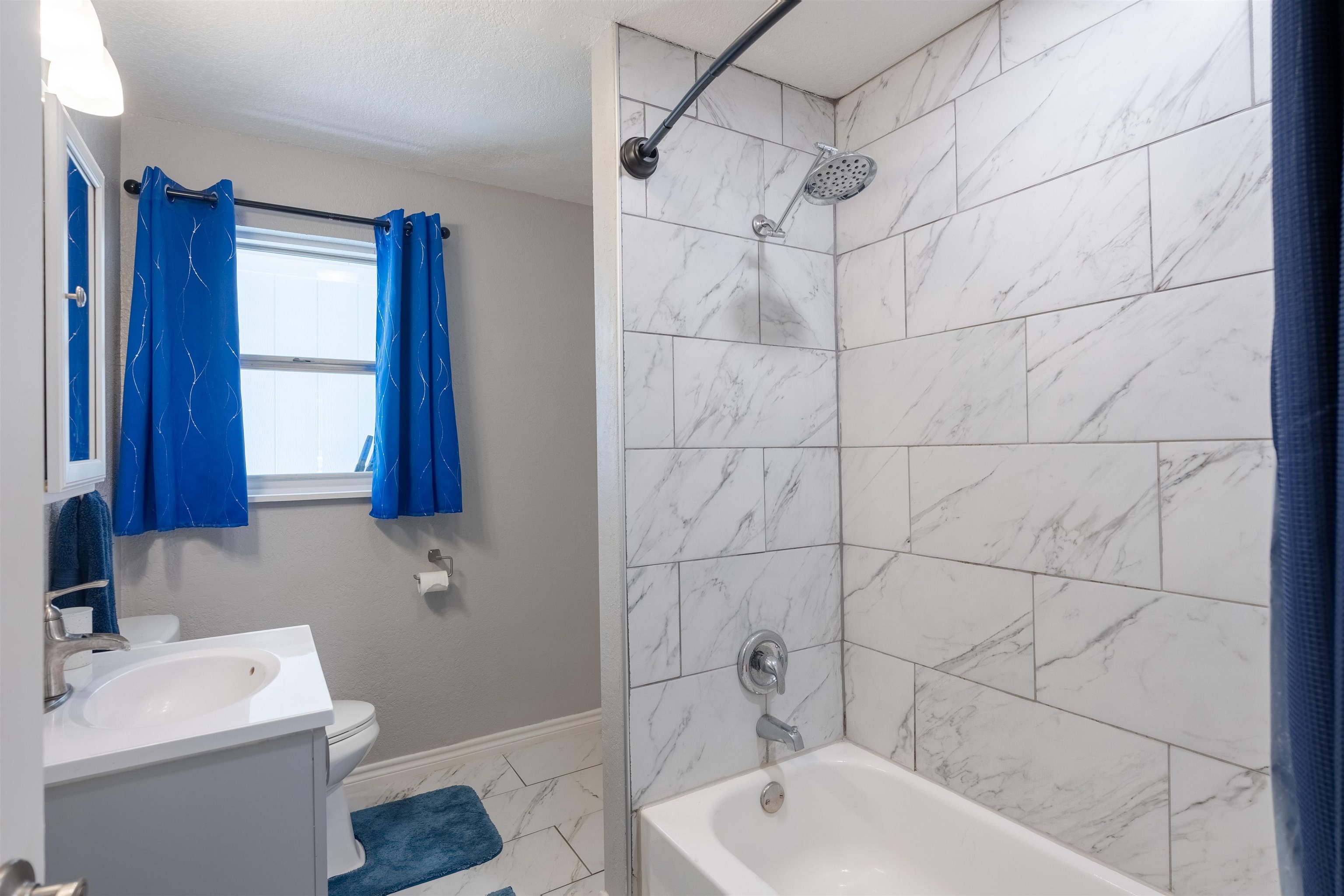 407 Lamon Street Burnet, TX 78611 - Photo 14 of 24 a bathroom with a sink toilet and shower