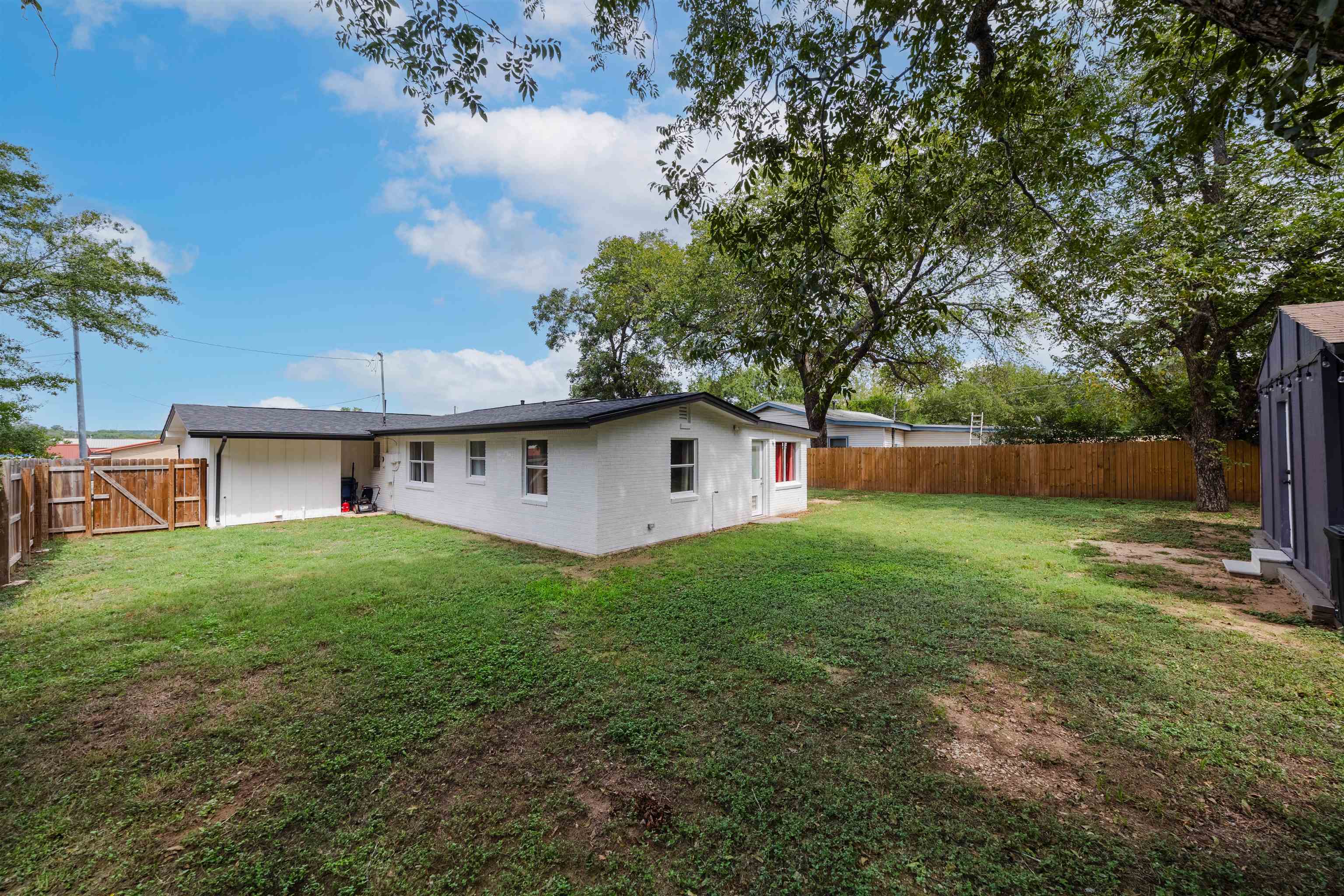 407 Lamon Street Burnet, TX 78611 - Photo 22 of 24 a view of a house with a yard