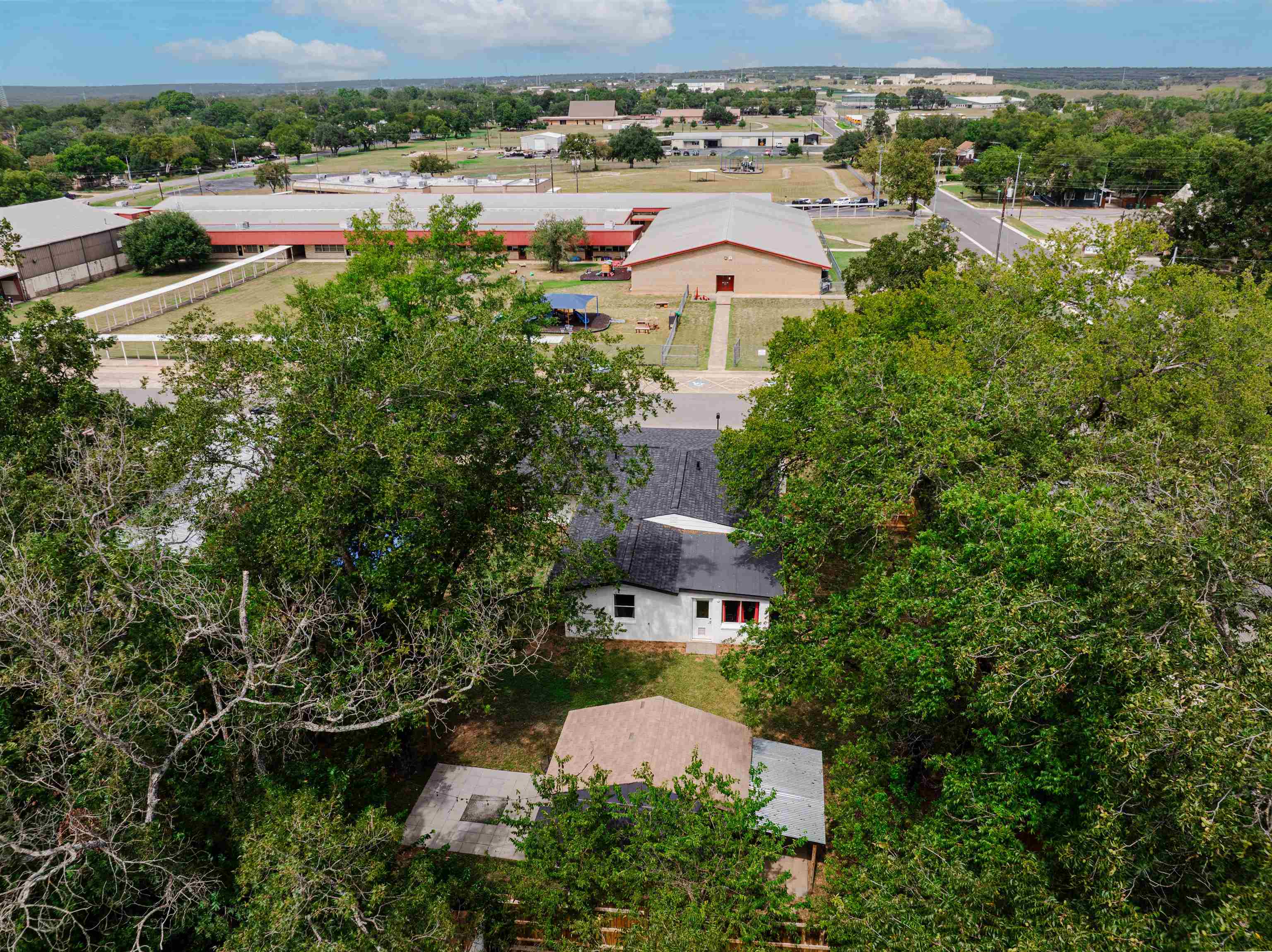 407 Lamon Street Burnet, TX 78611 - Photo 23 of 24 an aerial view of house with yard and ocean view