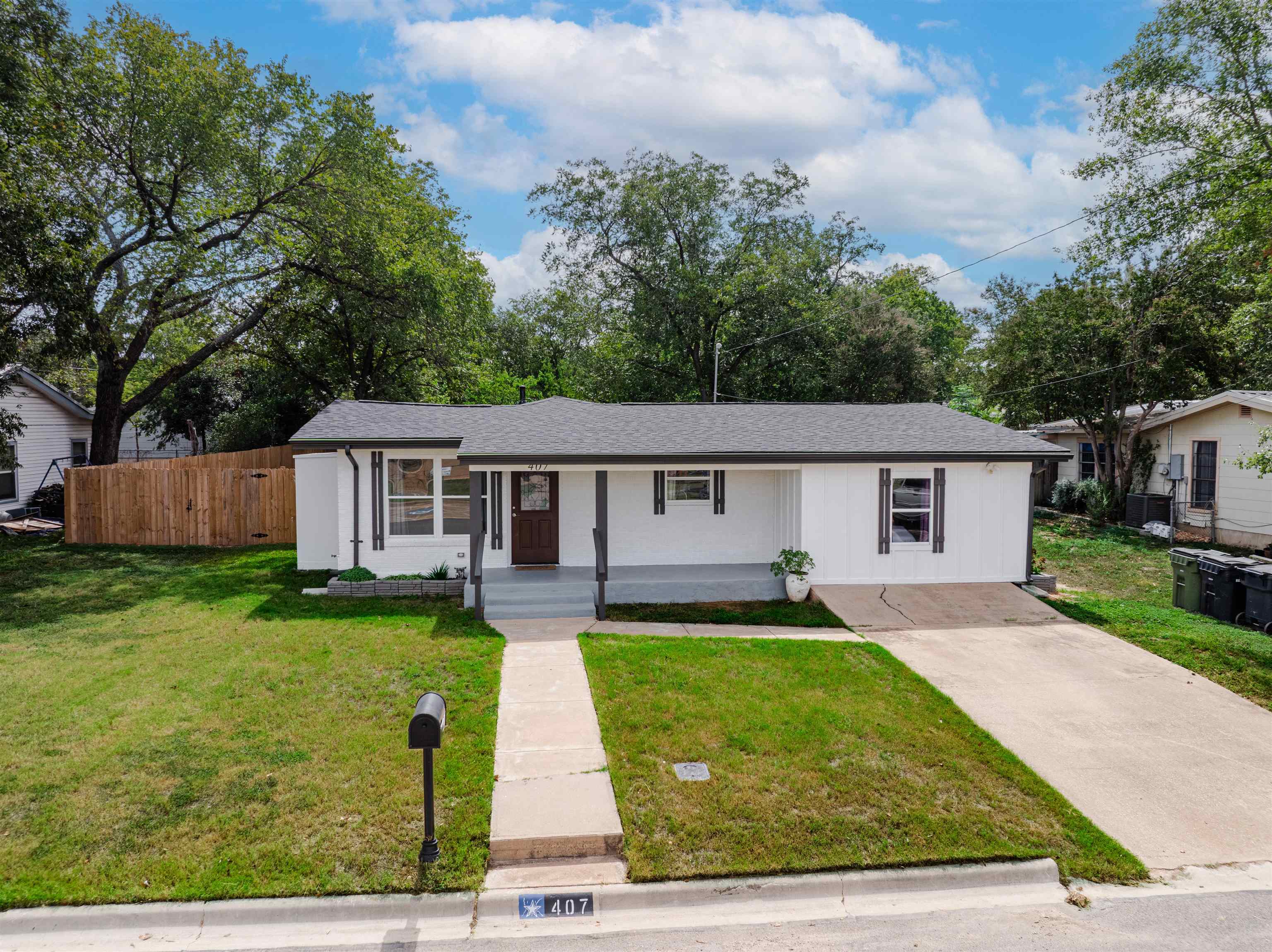 407 Lamon Street Burnet, TX 78611 - Photo 24 of 24 a front view of a house with garden