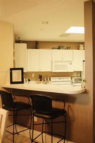 a view of a dining table and chairs