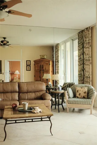 a living room with furniture gym and a window