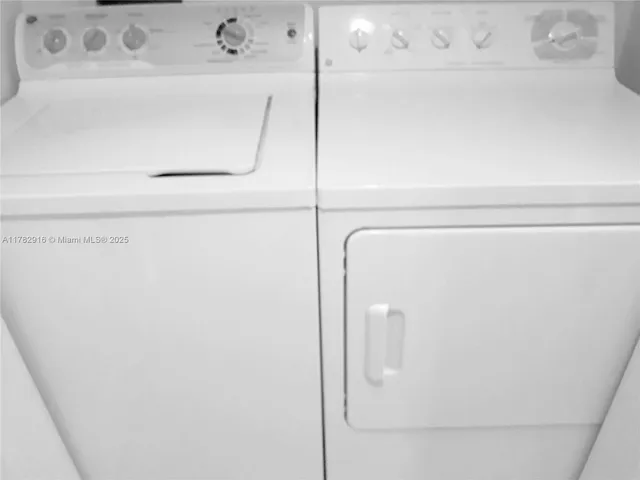 a living room with a couch and a stove next to a window