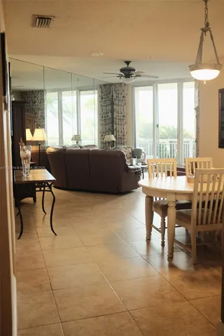 a living room with furniture a window and a table