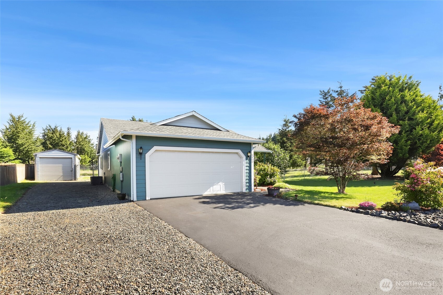 8008 188th Avenue Southwest Rochester, WA 98579 - Photo 1 of 40 a front view of a house with a yard and garage