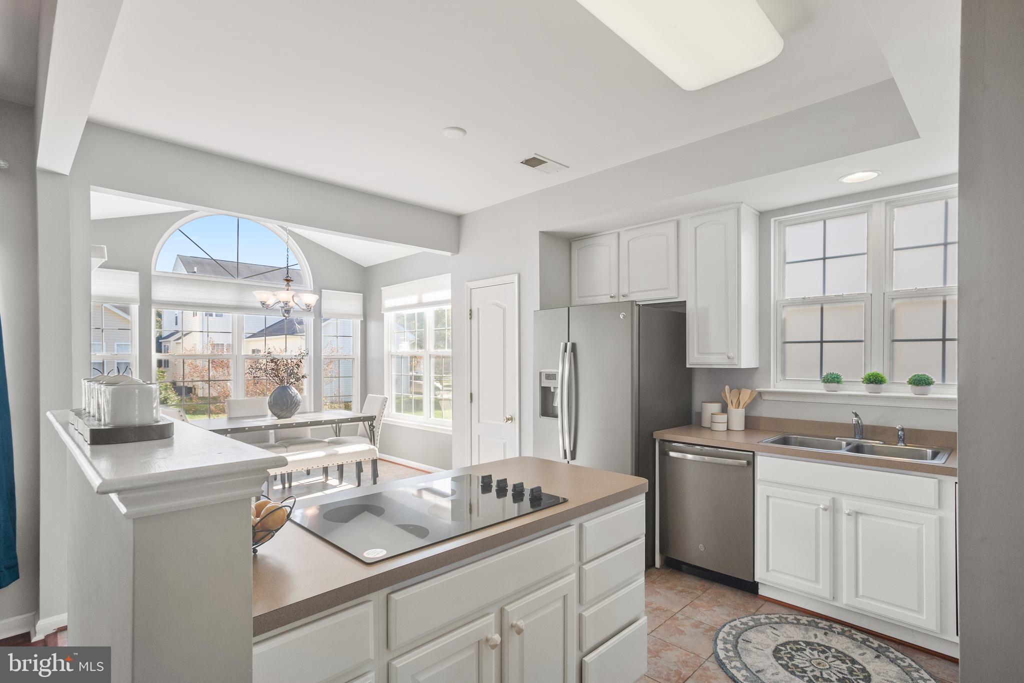 204 Coleman Drive Easton, MD 21601 - Photo 12 of 43 Kitchen with tile floor and stainless appliances