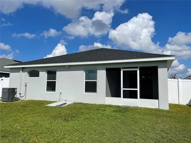 a view of a backyard of the house