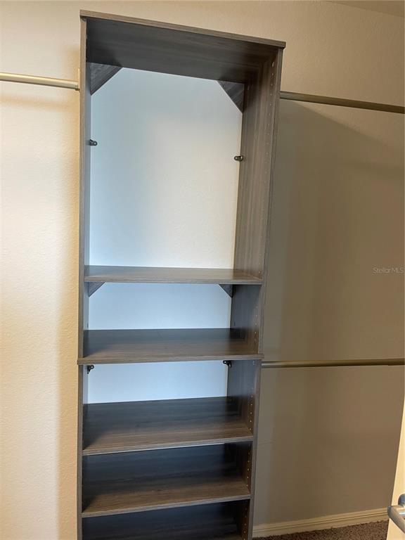 3623 Peregrine Way Lakeland, FL 33811 - Photo 23 of 35 a view of walk in closet with empty racks