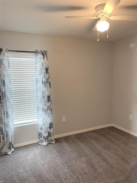3623 Peregrine Way Lakeland, FL 33811 - Photo 26 of 35 wooden floor in an empty room with a window