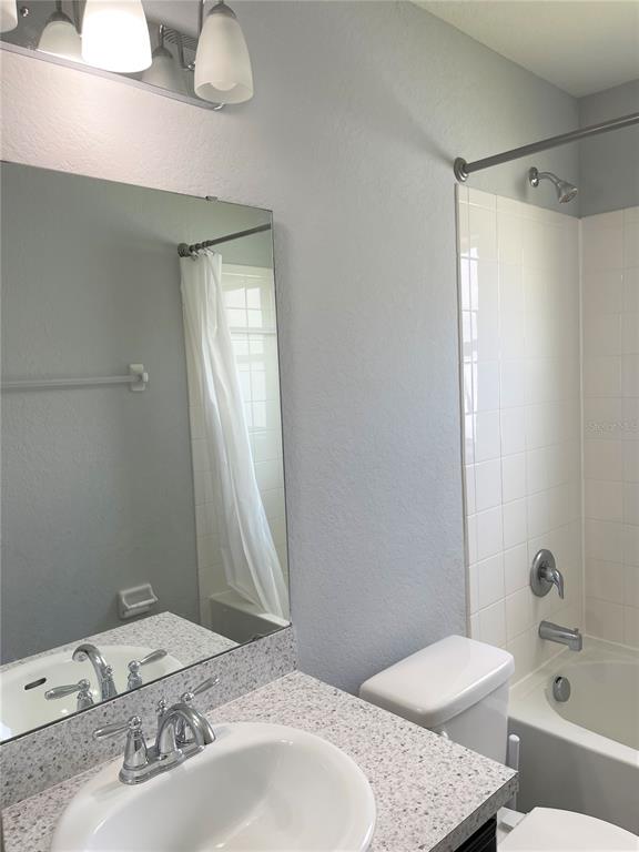 3623 Peregrine Way Lakeland, FL 33811 - Photo 31 of 35 a bathroom with a sink and a mirror