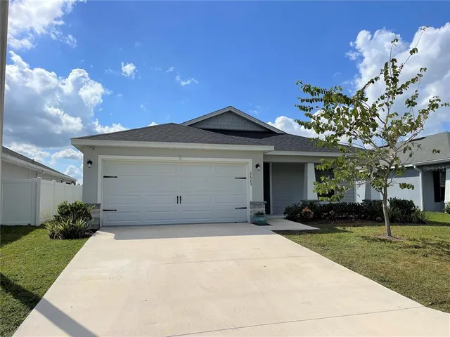 a front view of a house with lots of yellow lighting