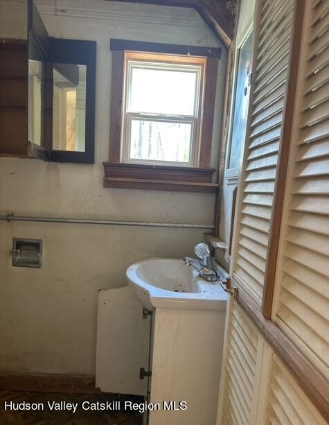 725 Highway 32 Tillson, NY 12486 - Photo 14 of 26 a bathroom with a sink and a mirror