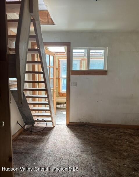 725 Highway 32 Tillson, NY 12486 - Photo 15 of 26 an empty room with wooden floor and windows