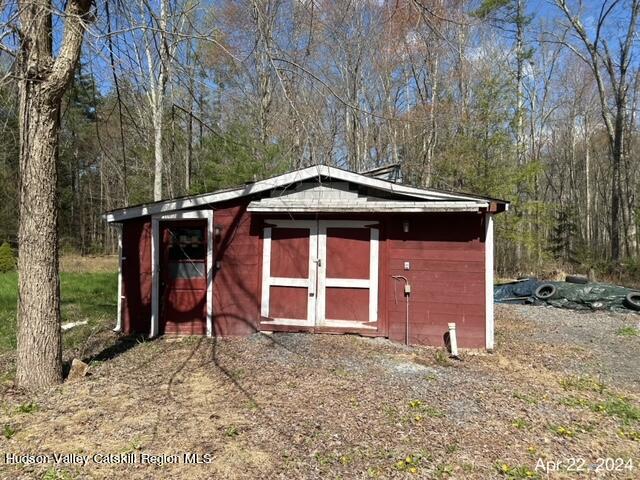 725 Highway 32 Tillson, NY 12486 - Photo 5 of 26 a front view of a house with a yard