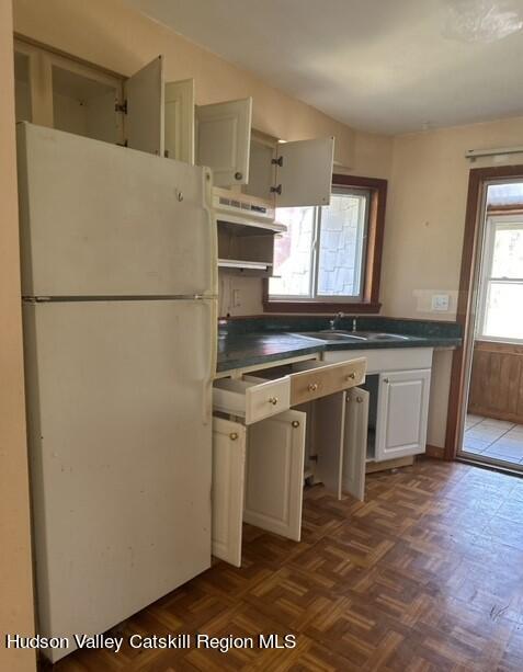 725 Highway 32 Tillson, NY 12486 - Photo 9 of 26 a white refrigerator freezer sitting inside of a kitchen