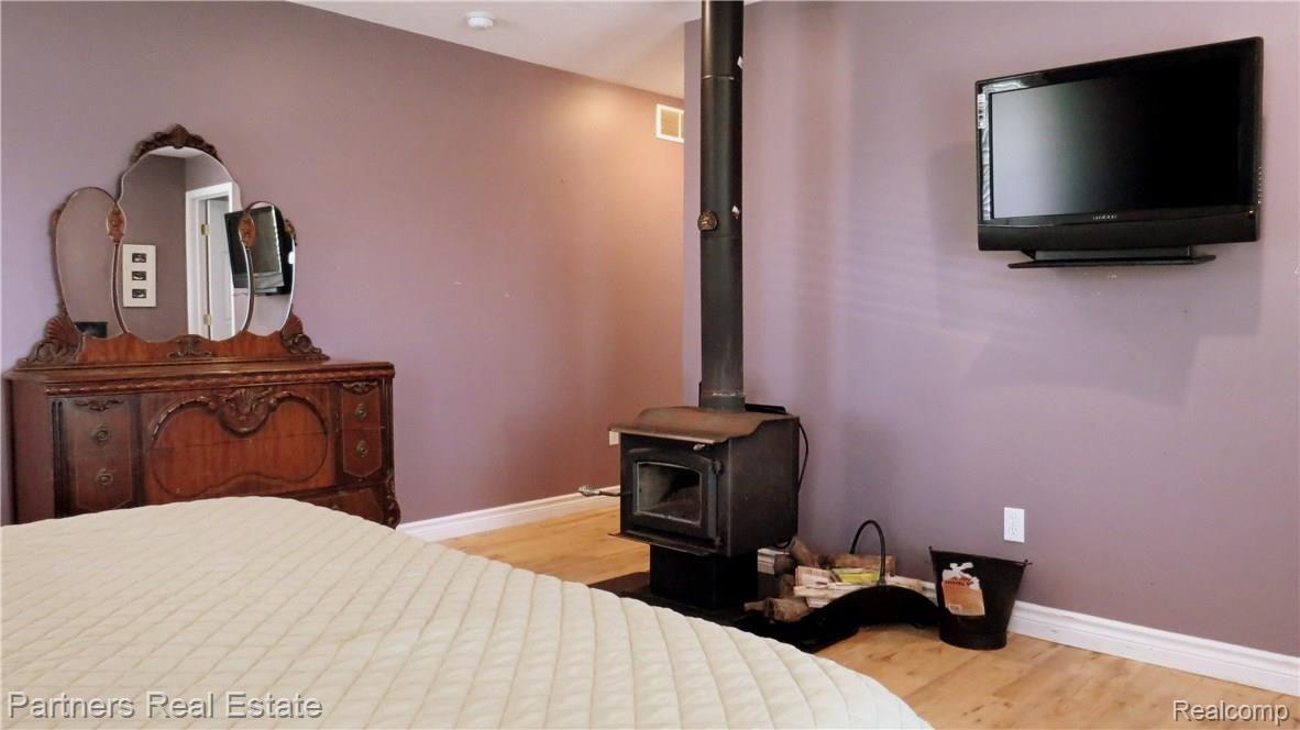4850 Deal Road Fowlerville, MI 48836 - Photo 28 of 49 Wood Burner adds Cozy Ambiance for Our Fall & Winter Michigan Evenings