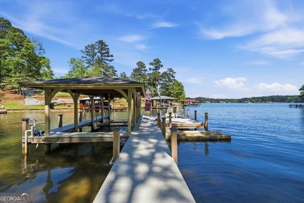 730 Marigold Road Sparta, GA 31087 - Photo 2 of 35 a view of a lake with chairs