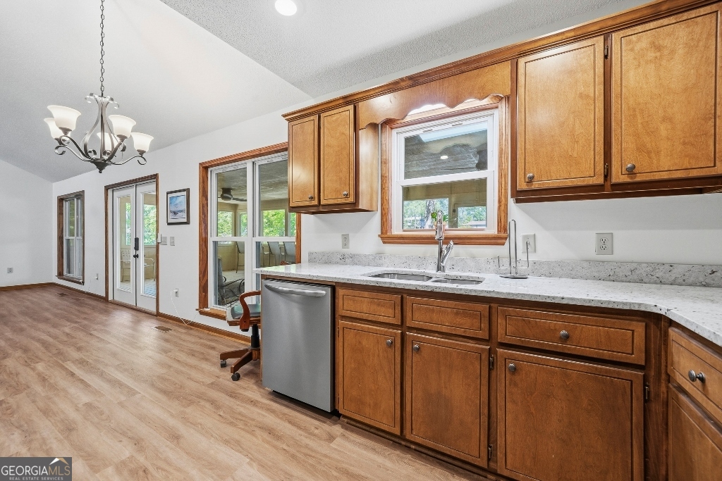 730 Marigold Road Sparta, GA 31087 - Photo 21 of 35 a kitchen with stainless steel appliances granite countertop cabinets and a large window