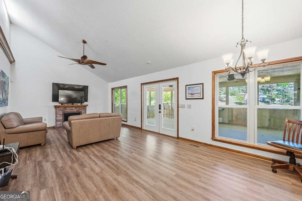 730 Marigold Road Sparta, GA 31087 - Photo 22 of 35 a living room with furniture and a chandelier