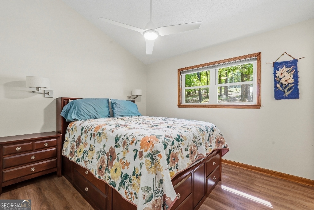 730 Marigold Road Sparta, GA 31087 - Photo 24 of 35 a bedroom with a bed and wooden floor