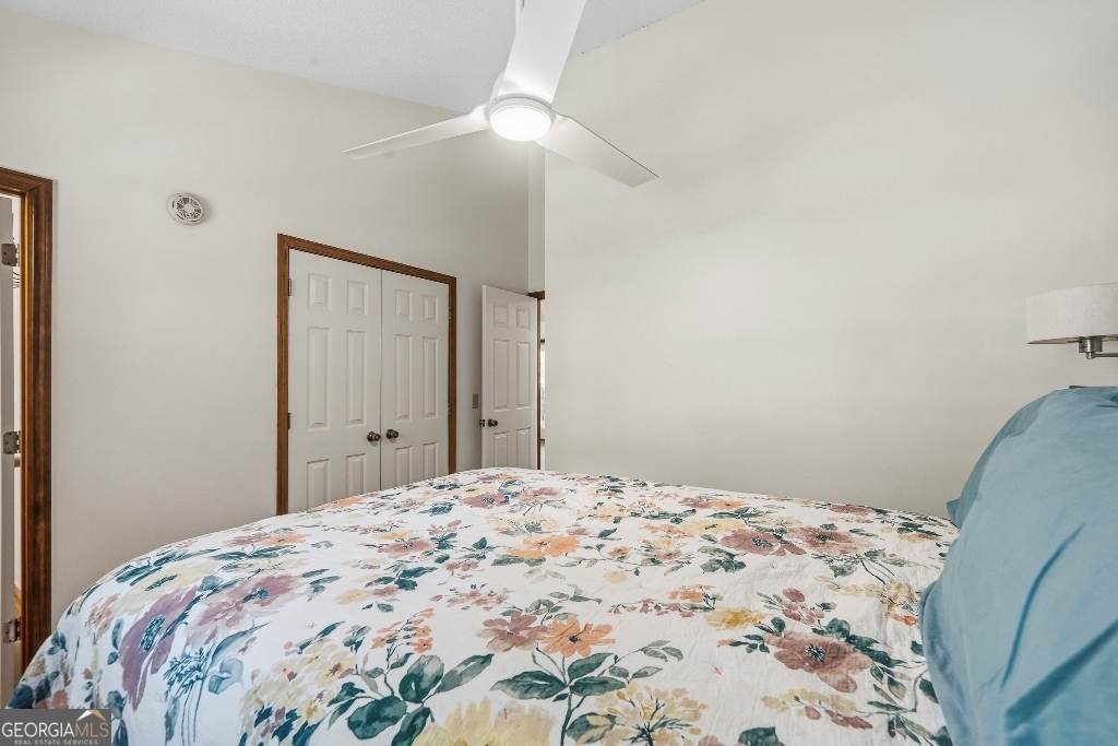 730 Marigold Road Sparta, GA 31087 - Photo 25 of 35 a bedroom with a bed and a mirror
