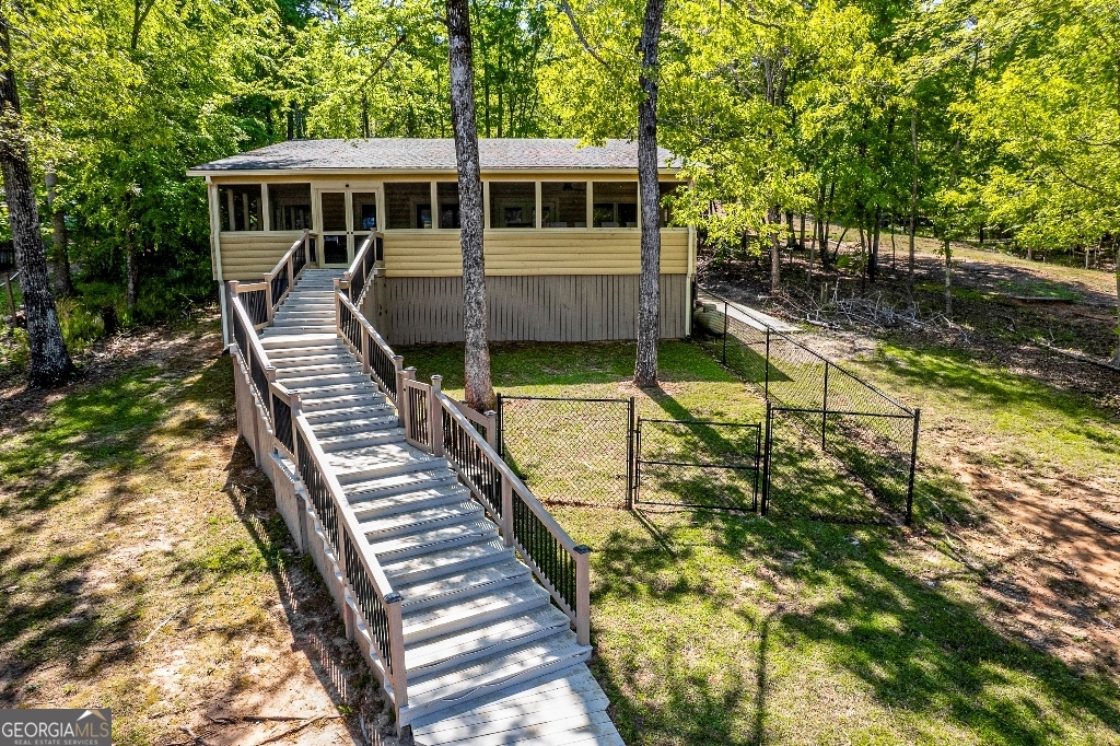 730 Marigold Road Sparta, GA 31087 - Photo 30 of 35 a view of a house with backyard and sitting area