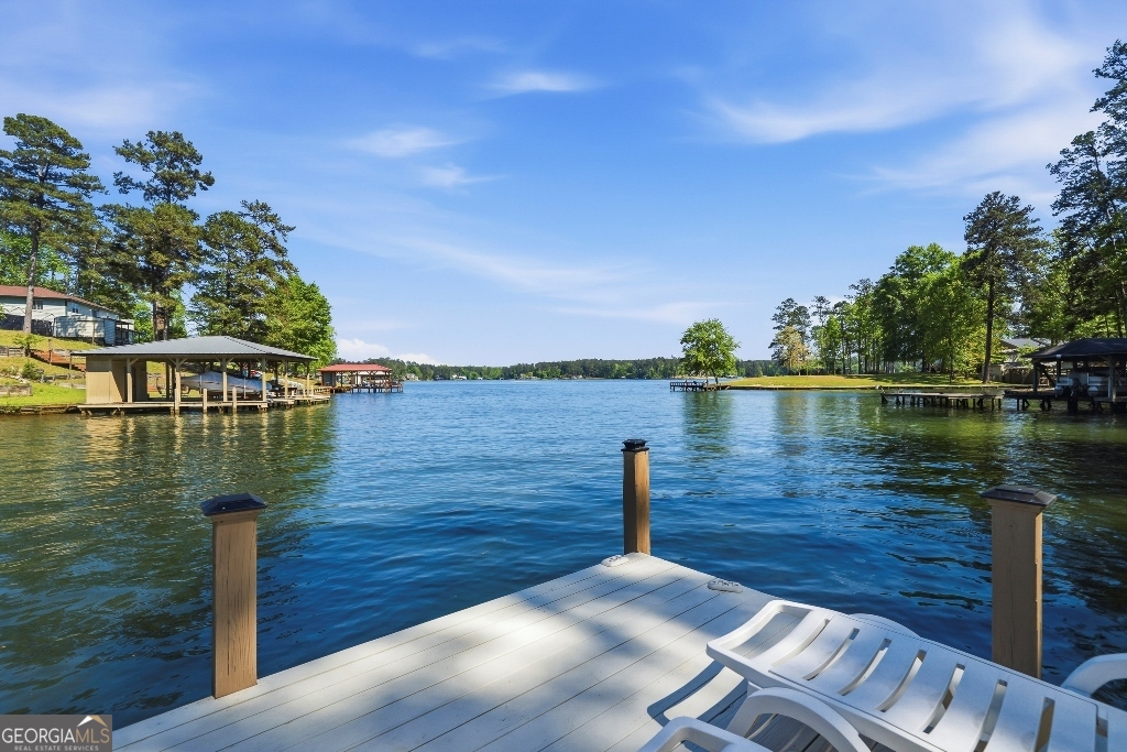 730 Marigold Road Sparta, GA 31087 - Photo 3 of 35 a view of a lake with houses in the back