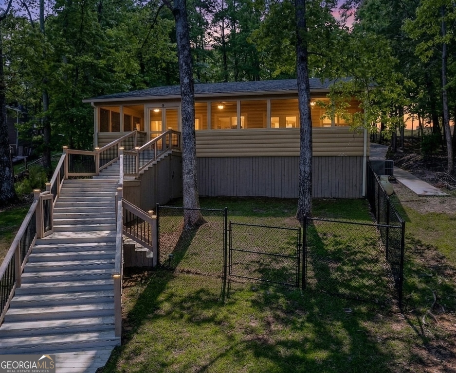 730 Marigold Road Sparta, GA 31087 - Photo 32 of 35 a view of a house with backyard and sitting area