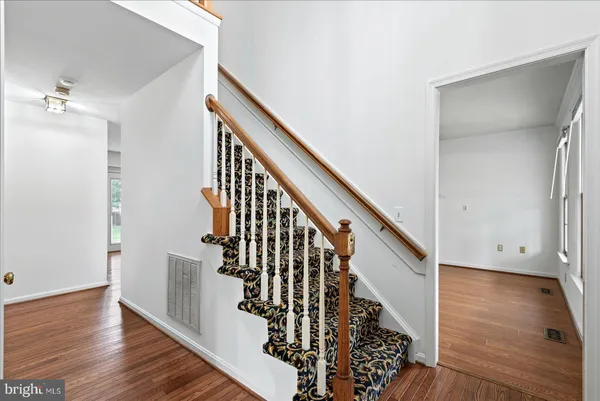 a view of entryway with wooden floor
