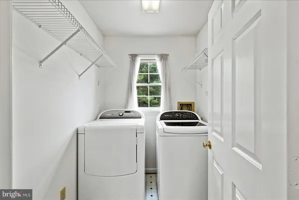 a kitchen that has a stove and a white refrigerator