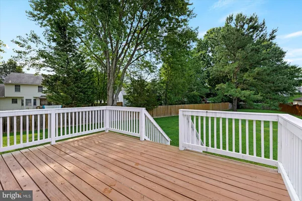 a view of deck with wooden floor and fence