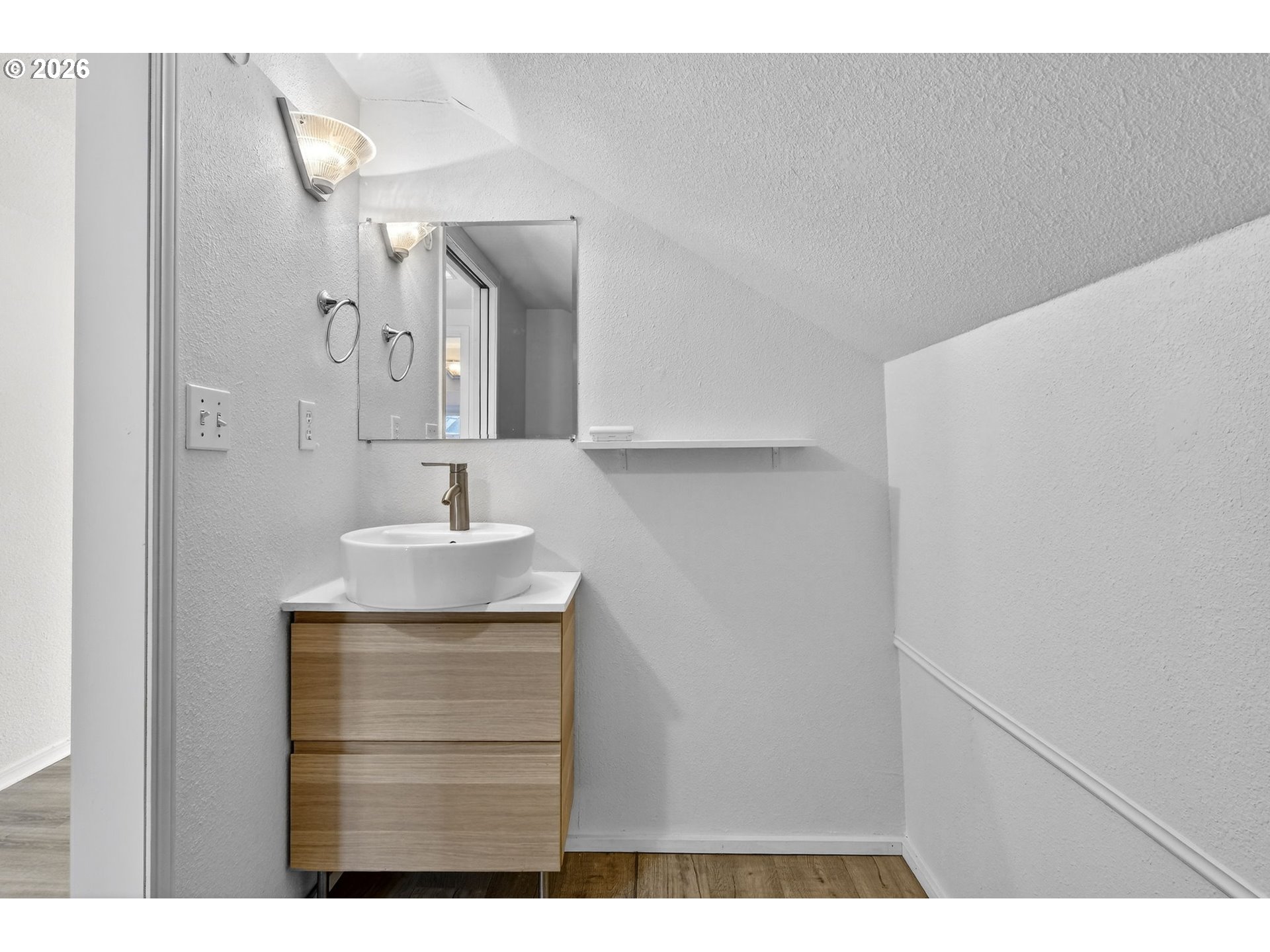 134 South 3rd Street St. Helens, OR 97051 - Photo 18 of 21 a bathroom with a sink a mirror and vanity