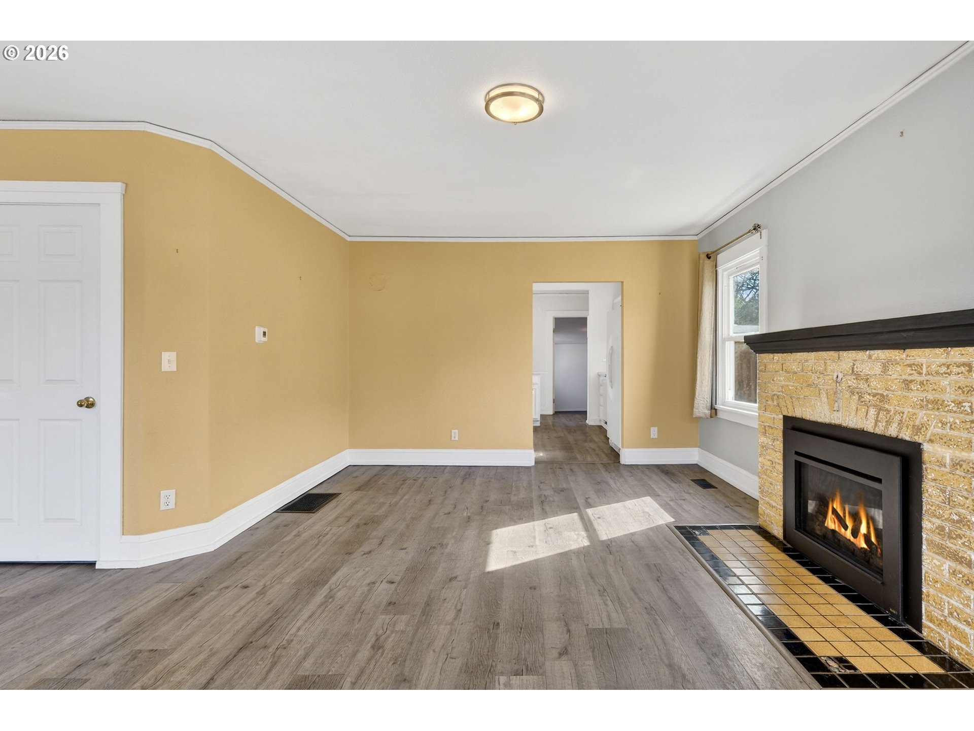 134 South 3rd Street St. Helens, OR 97051 - Photo 5 of 21 a view of an empty room and a fireplace