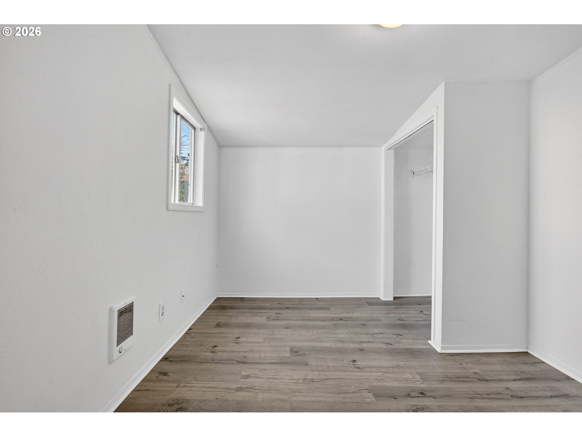 134 South 3rd Street St. Helens, OR 97051 - Photo 10 of 21 a view of an empty room with wooden floor