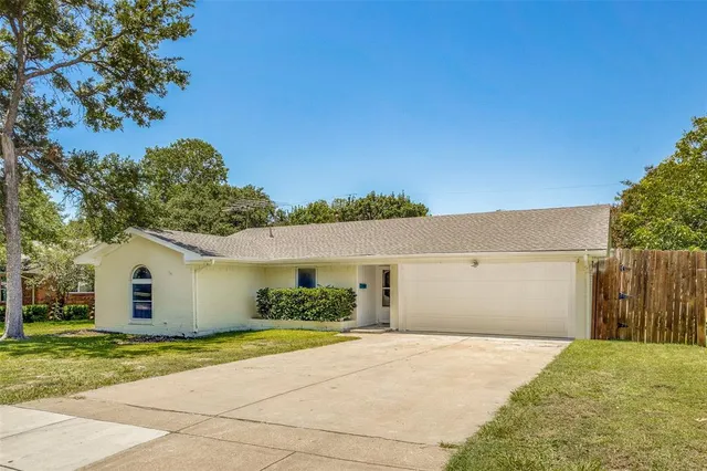 a view of garage and yard