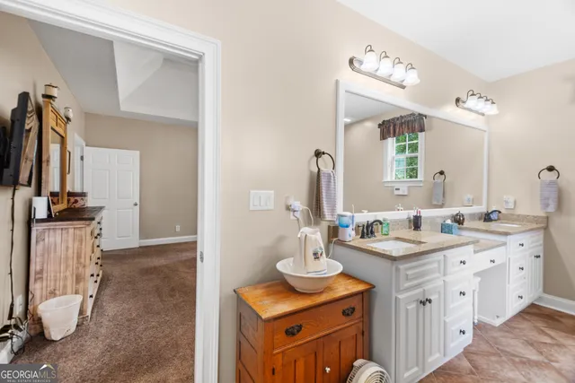 a bedroom with bed and window