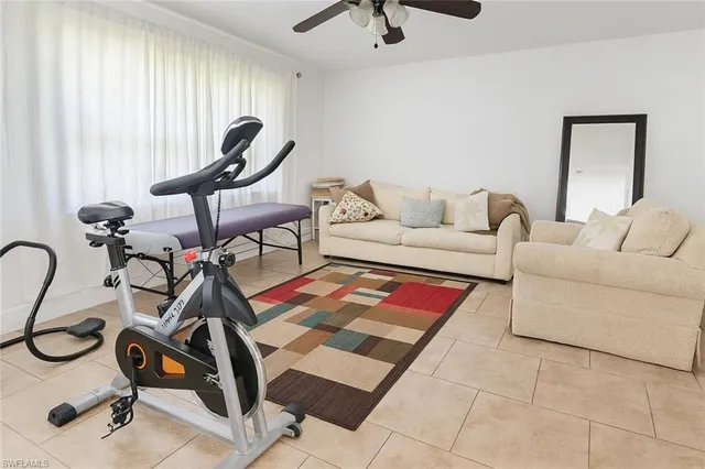 a view of kitchen with furniture and refrigerator