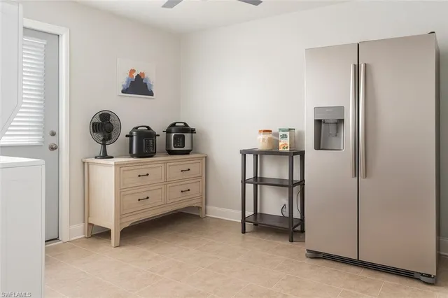 a bedroom with a bed and white cabinets